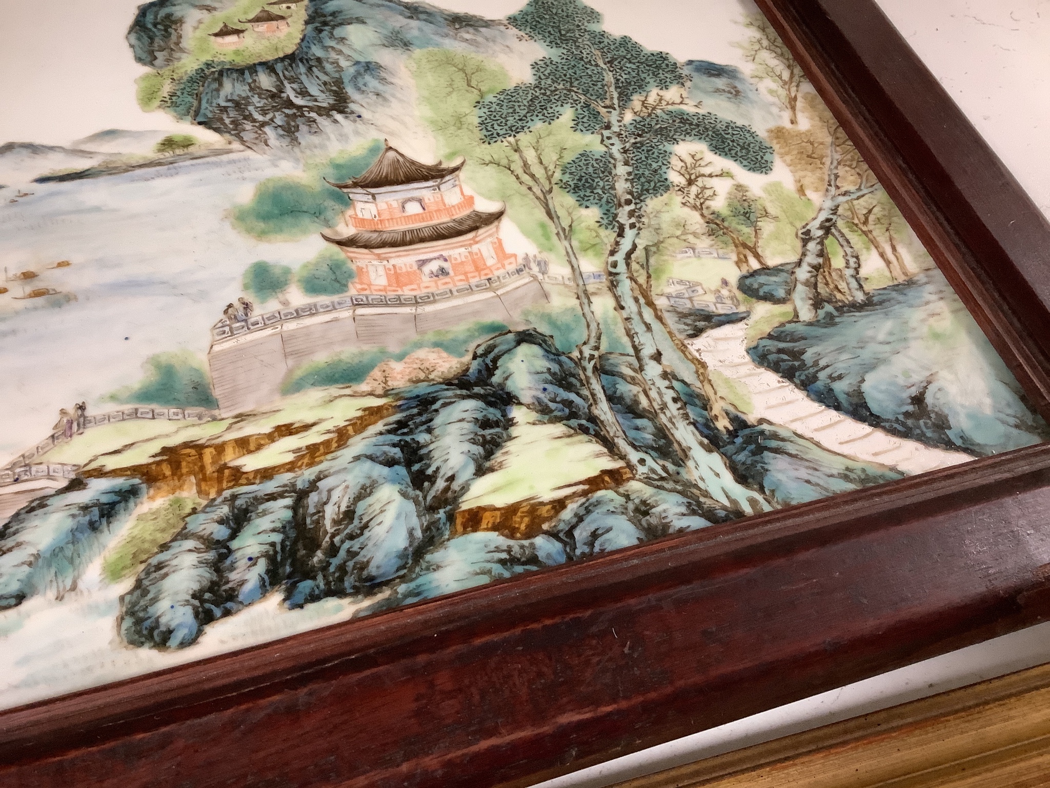 A Chinese enamelled porcelain plaque, in hardwood frame, 27 x 41cm excl. frame